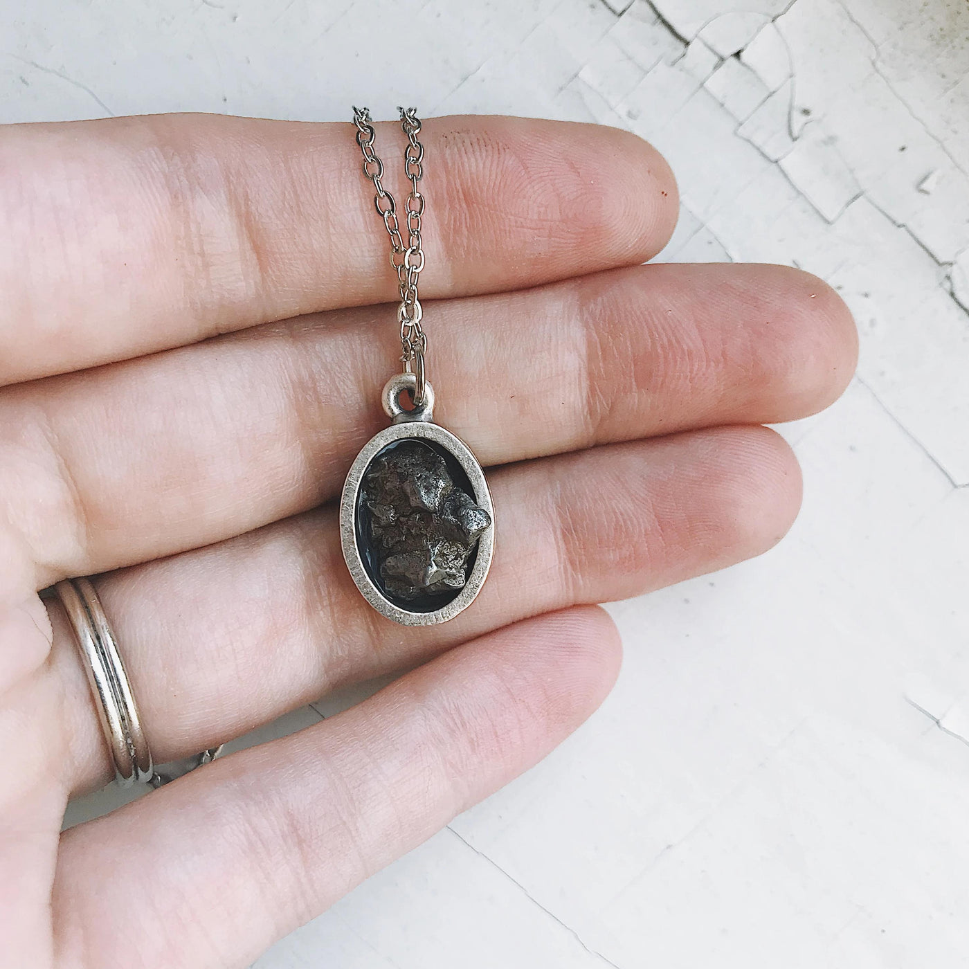Oval Raw Meteorite Pendant Necklace in Matte Brushed Silver - Roses & Chains | Fashionable Clothing, Shoes, Accessories, & More
